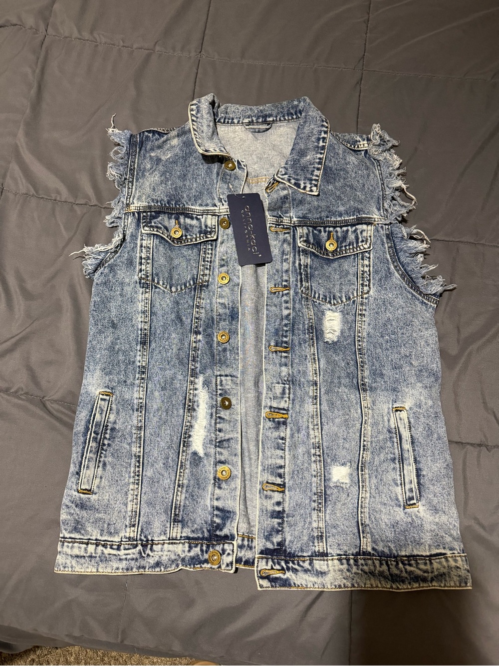 Acid-Wash Sleeveless Denim Vest with Distressed Details